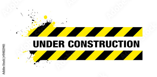 Abstract grunge under construction sign with splats