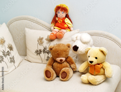 Soft toys on a white sofa photo