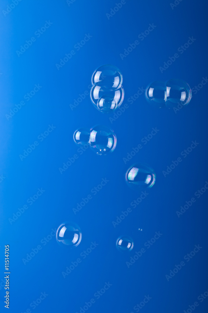 soap bubbles over blue background
