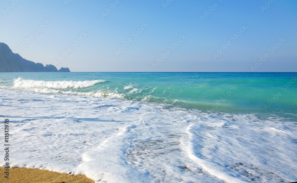 Fototapeta premium Sky, sea, waves and sandy beach.