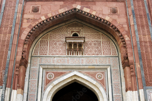 Ornate entrance to an ancient mosque in Delhi, India.