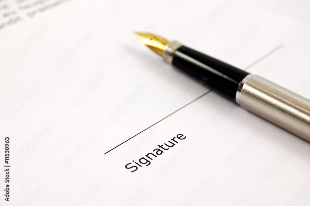 A document with a place for a signature and a gold-nibbed pen A document with a place for a signature and a gold-nibbed pen