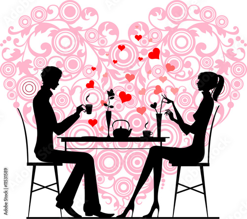 Silhouette of a couple sitting and talking at cafe