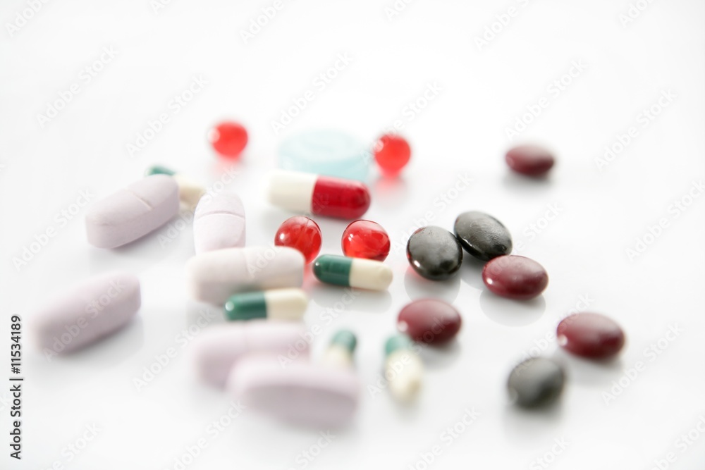 pills over white, health or suicide
