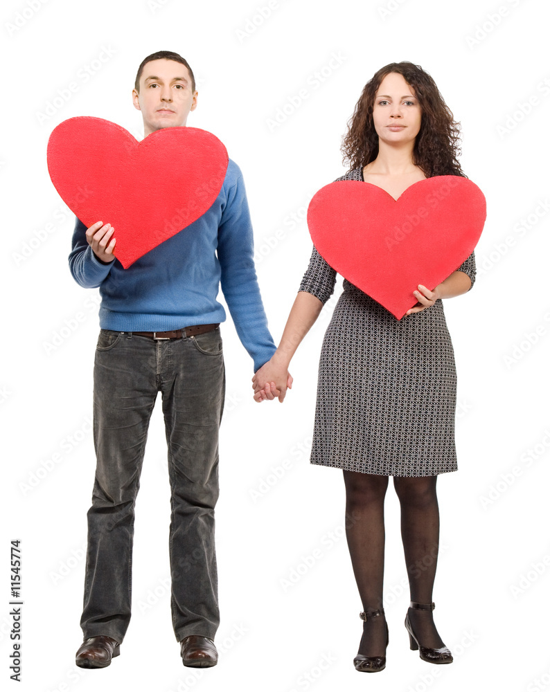 couple hoding two red hearts couple hoding two red hearts