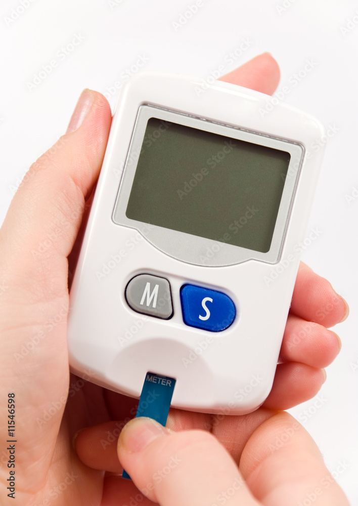 Woman with diabetes measuring blood sugar level