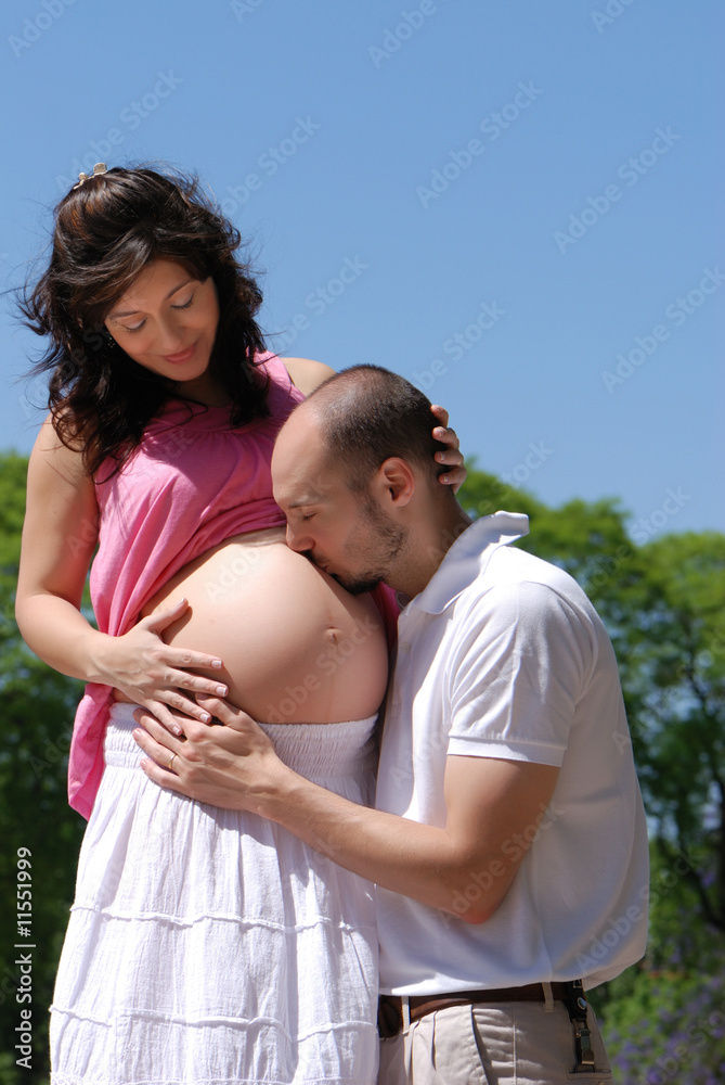 Happy beautiful pregnant woman and her husband Happy beautiful pregnant woman and her husband