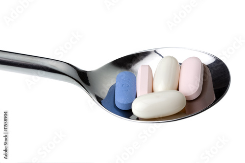 Daily HIV medication on spoon