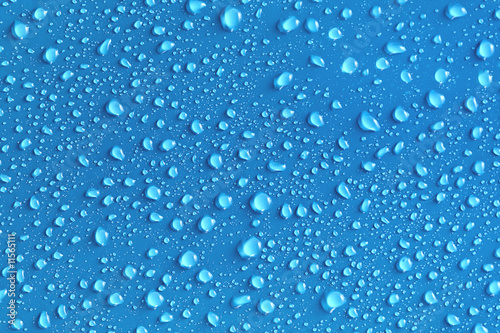 Water drops on a blue surface