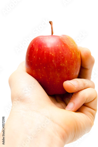 apple in hand isolated on white