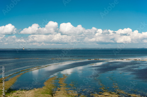 Cloudy seascape at low tide