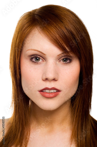 Beautiful young red haired woman isolated on a white background