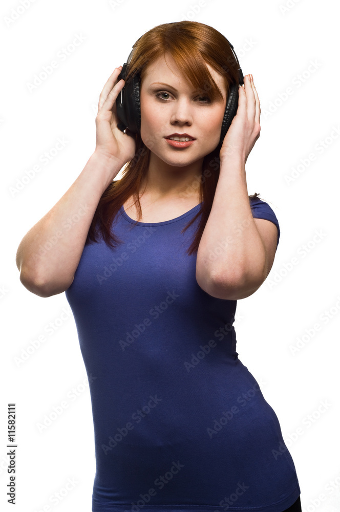 Beautiful young Redhead woman with headphones Beautiful young Redhead woman with headphones