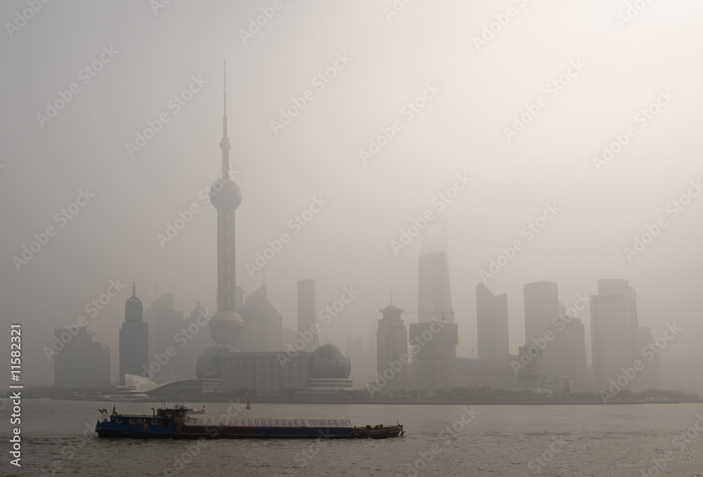 air pollution over Shanghai, a barge is passing