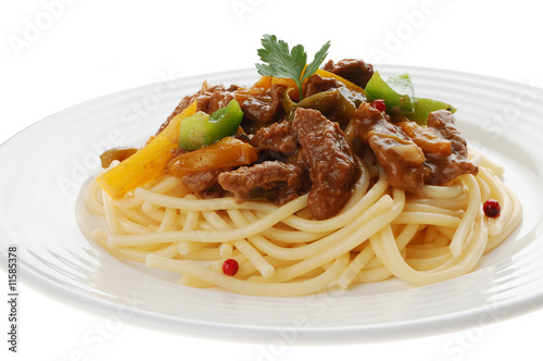 Pasta with meat and vegetables isolated on white background