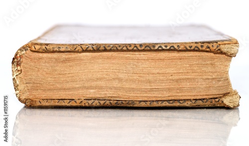 Old Book lying down flat isolated by white