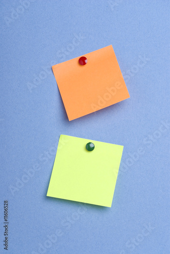 Green and orange pinned postits