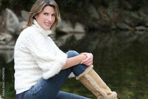 Gorgeous Woman in White Sweater at a Lake