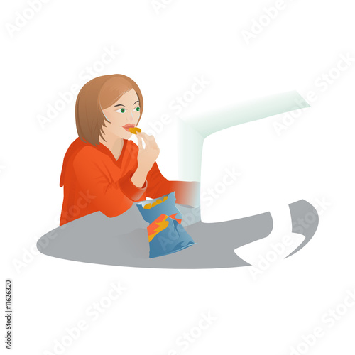Girl snaks in front of the computer and surfs