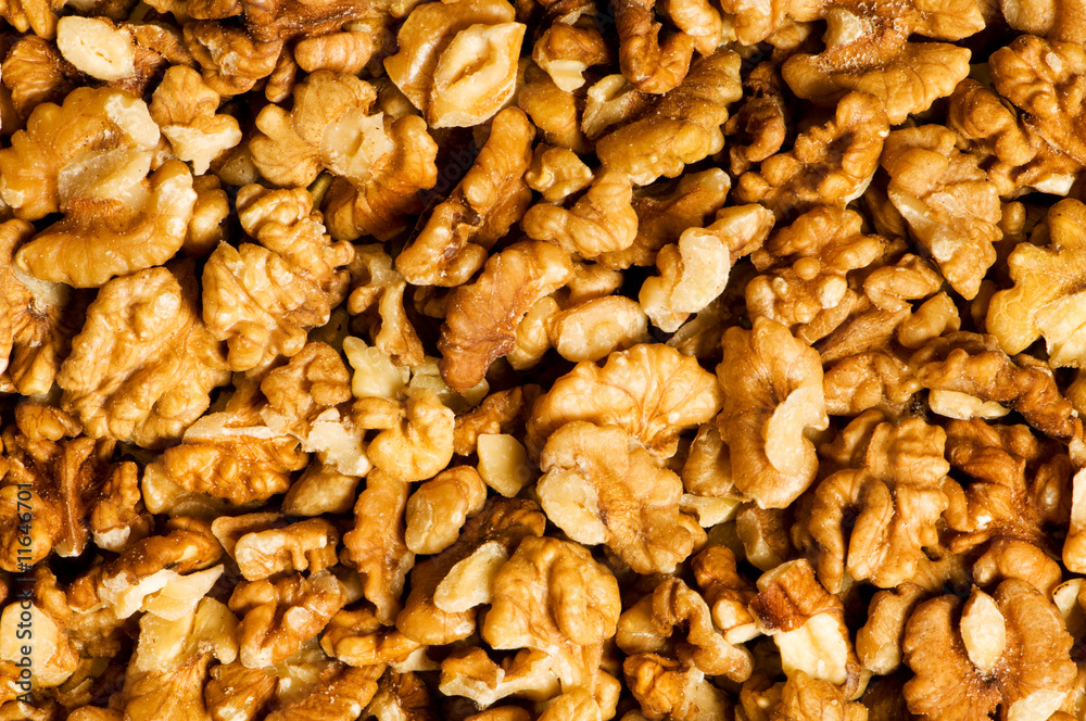 Background made of fresh walnut nuts Background made of fresh walnut nuts