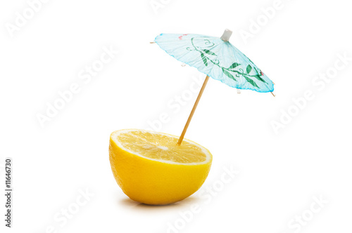 Lemon and umbrella isolated on the white