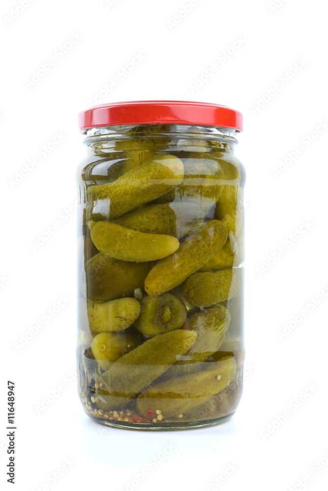 Glass jar with marinated cornichons Glass jar with marinated cornichons