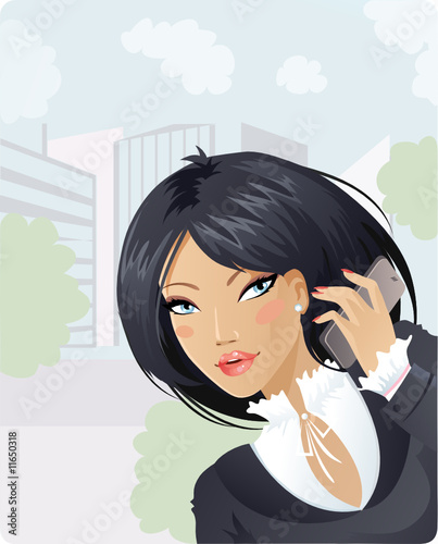 Cute businesswoman talking in the city by cellphone