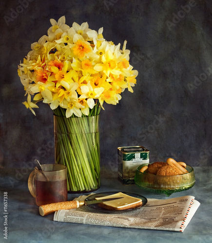 Still-life with a bouquet of narcissuses and a breakfast