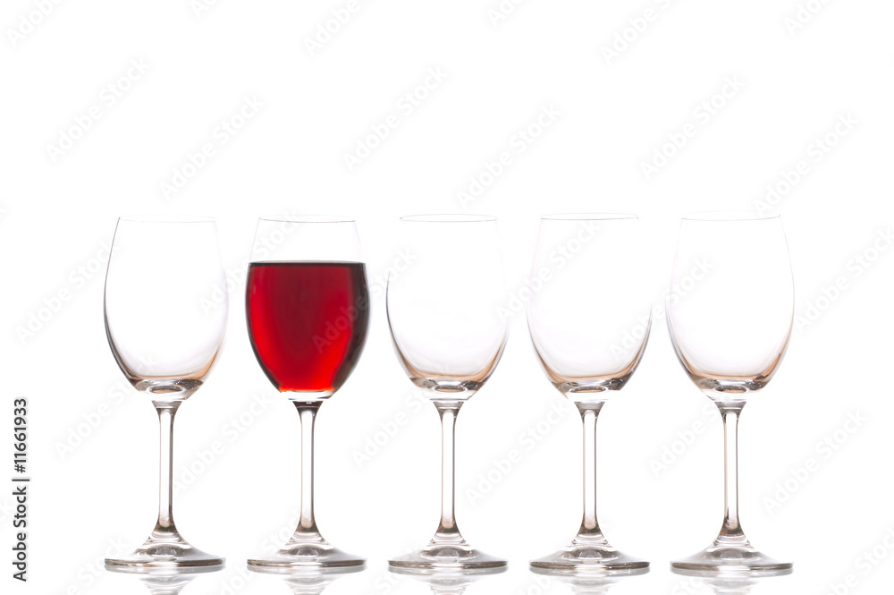Glasses with red wine on white background