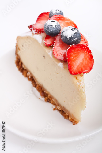 slice of cheesecake decorated with berries