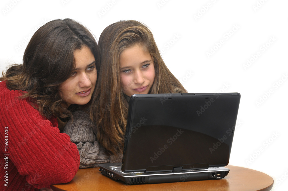 Young girls with laptop isolated against a white background