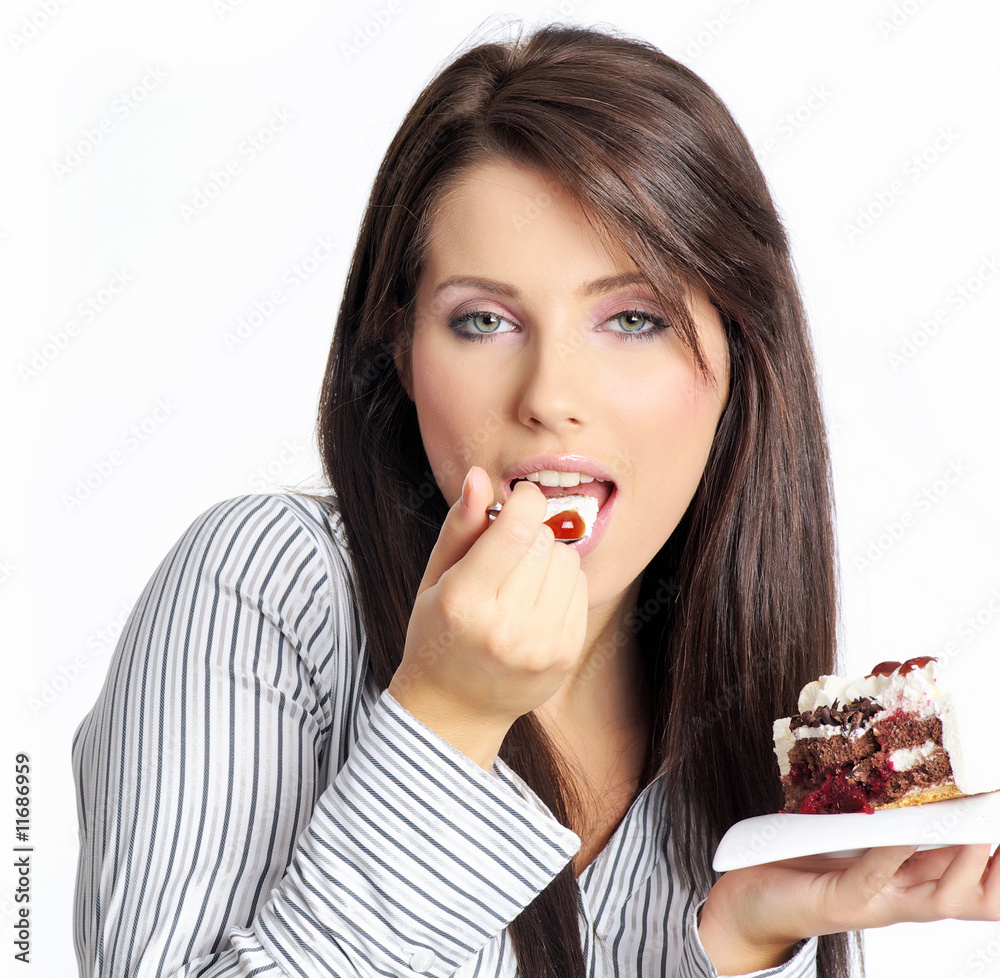 businesswoman wearing white shirt eating the cake. businesswoman wearing white shirt eating the cake.