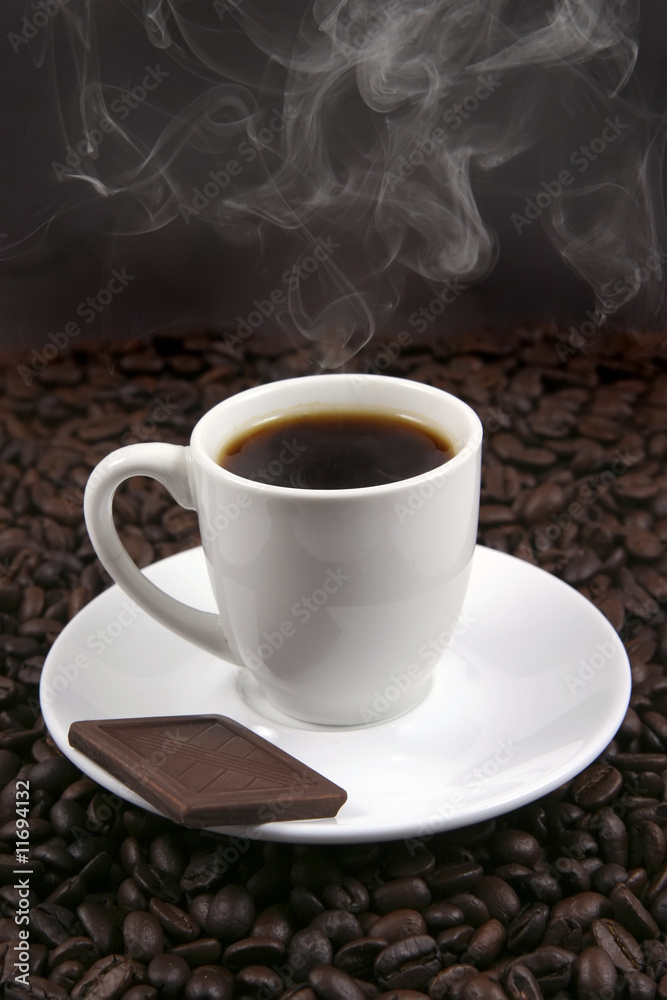 white porcelain coffee cup and chocolate white porcelain coffee cup and chocolate