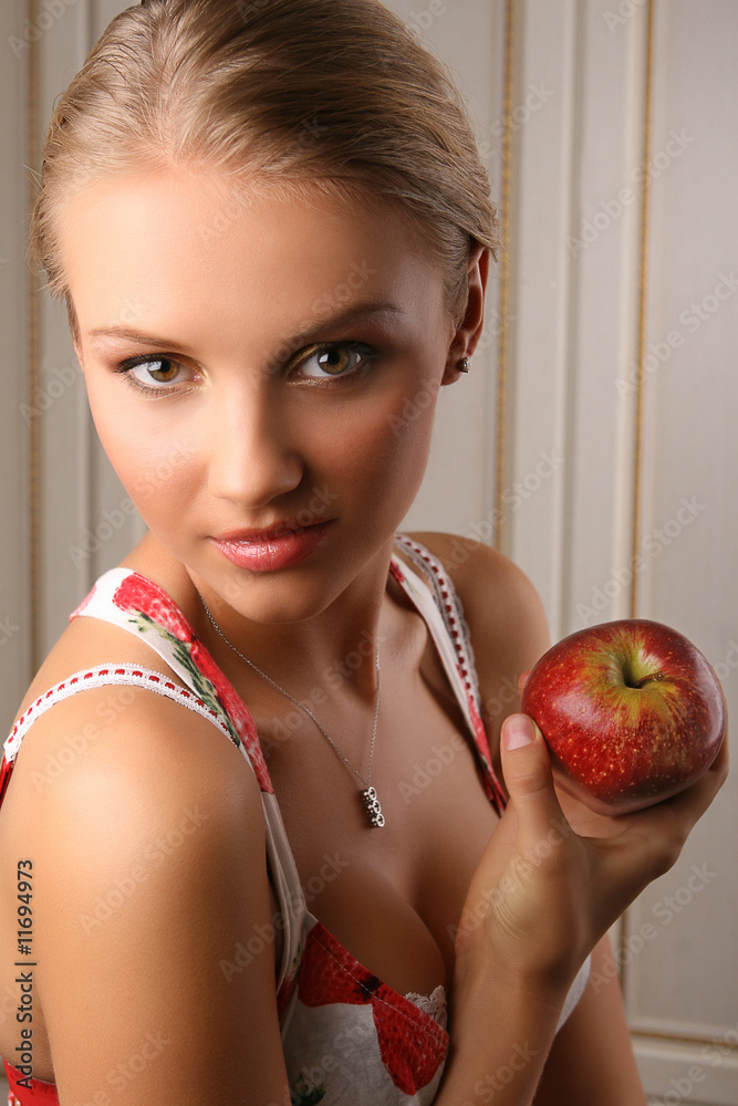 attractive young woman holding red apple attractive young woman holding red apple
