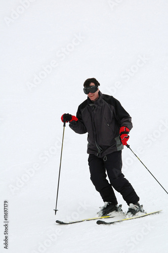 man downhill skiing
