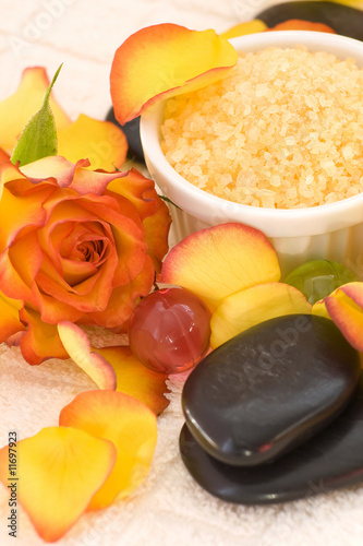 bath salt, rose pental and massage stones photo