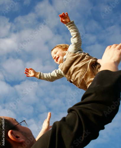 flying boy on sky background