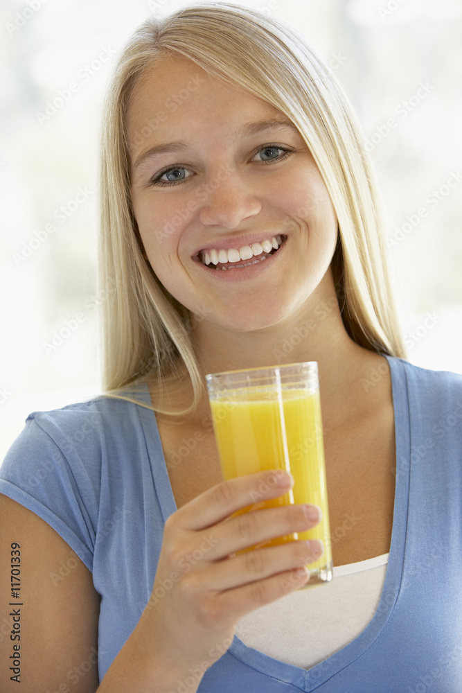 Teenage Girl Drinking A Glass Of Orange Juice Teenage Girl Drinking A Glass Of Orange Juice