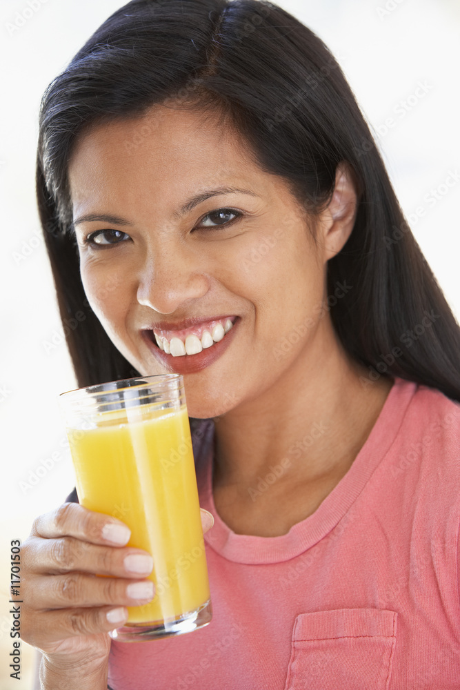 Mid Adult Woman Drinking Fresh Orange Juice Mid Adult Woman Drinking Fresh Orange Juice