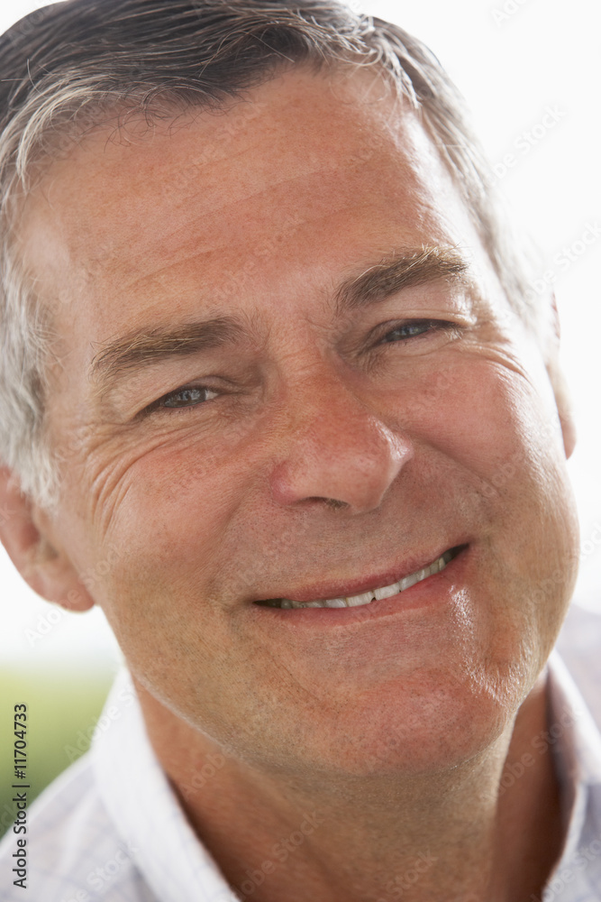 Obraz premium Portrait Of Middle Aged Man Smiling At The Camera