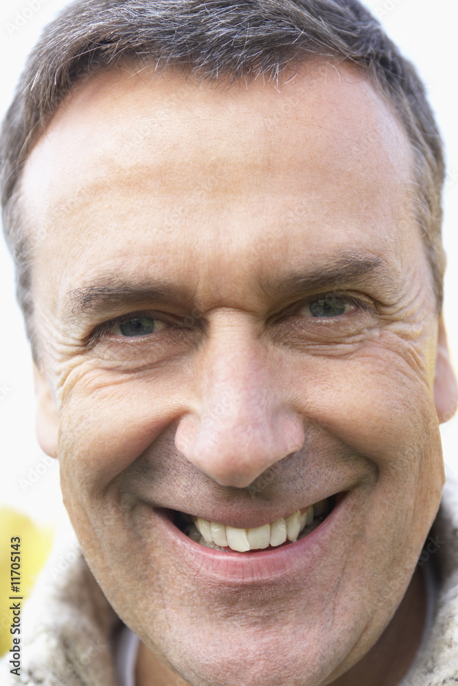 Fototapeta premium Middle Aged Man Smiling At The Camera