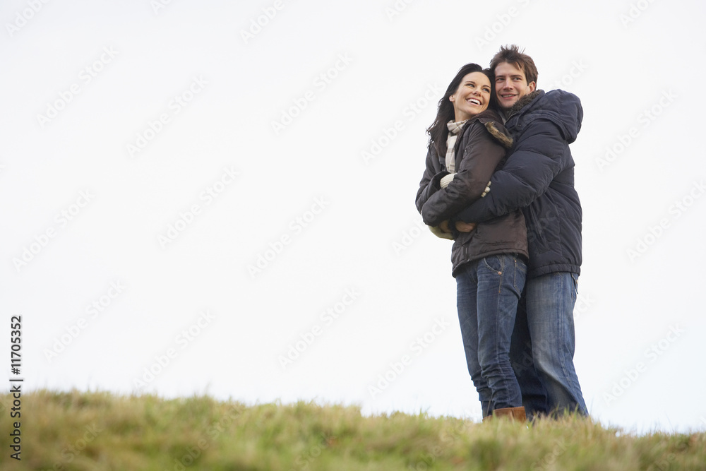 Couple Embracing In Park