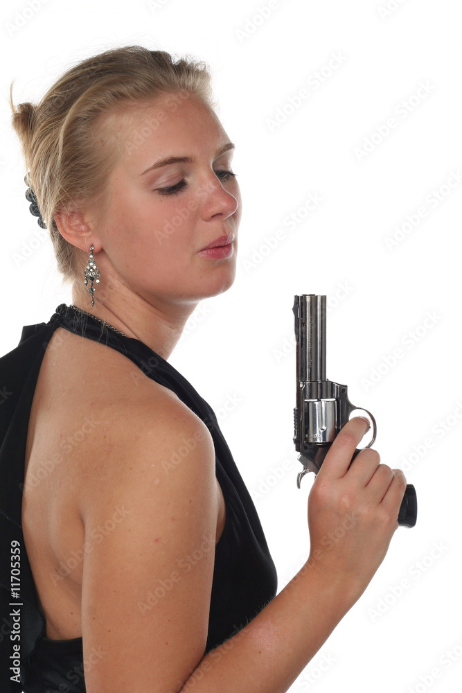 young blond woman in black dress with revolver young blond woman in black dress with revolver