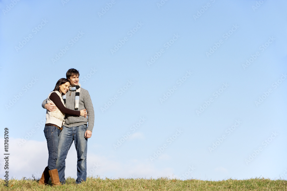 Couple Standing In The Park