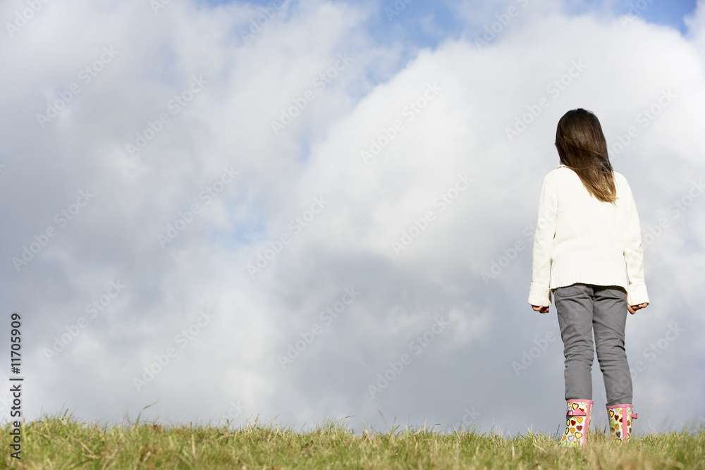 Young Girl Standing In The Park