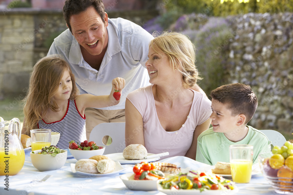 Family Eating An Al Fresco Meal