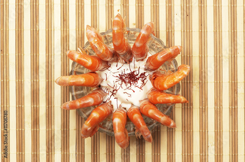 A plate of tiger shrimps with sauce photo