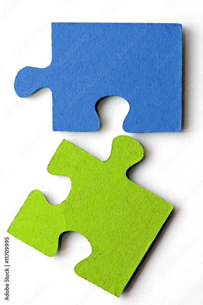 bright blue and green jig saw pieces bright blue and green jig saw pieces