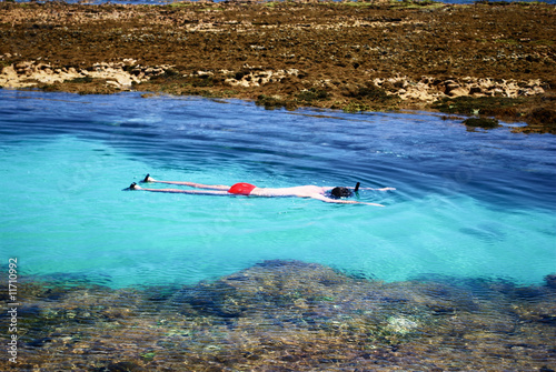 Swimming in crystalline clear waters in Maragogi,  Brazil