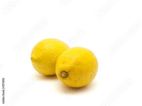 Two lemons on white background